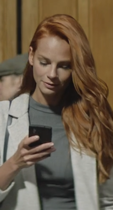 Audience member watching vertical video on a phone