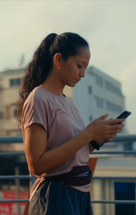 Audience member watching vertical video on a phone