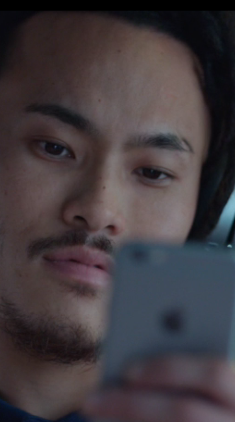 Audience member watching vertical video on a phone